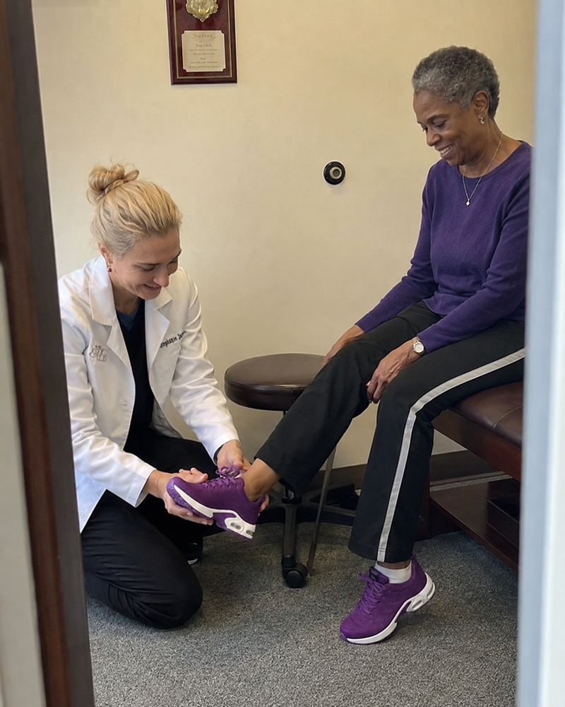 Patient testing Orthera shoes with doctor